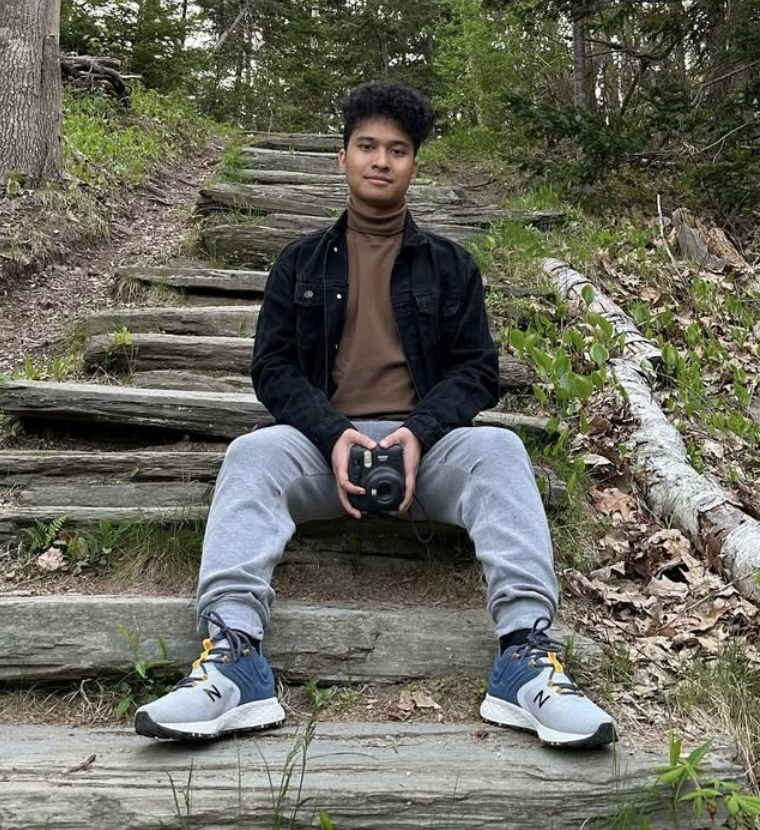 Profile photo of Min Aung Paing wearing professional attire, smiling at the camera